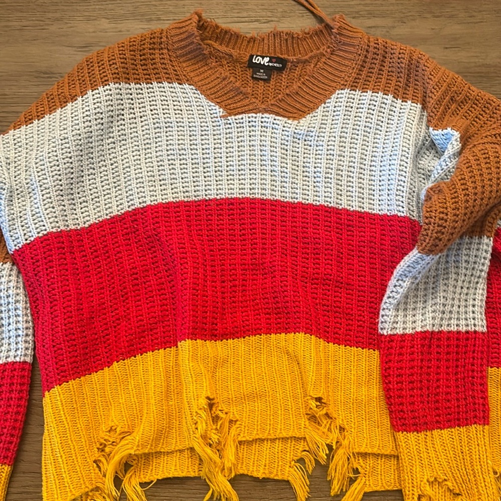 This is a love by chelsey sweater! its a Medium and has never been worn!